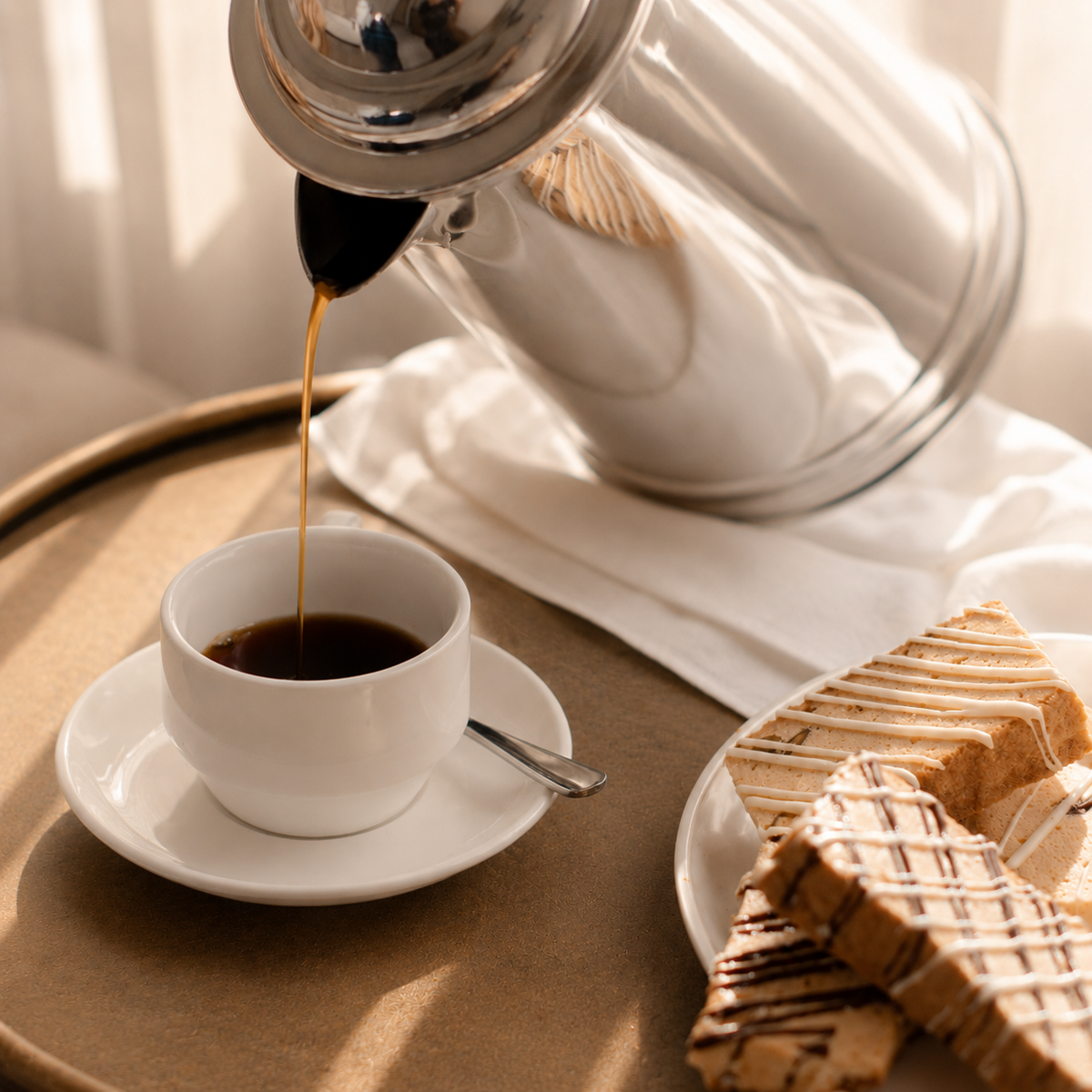 Giorgio coffee poured beside Italian biscotti