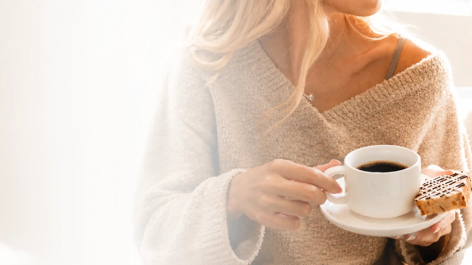 A cup of Giorgio coffee served with biscotti